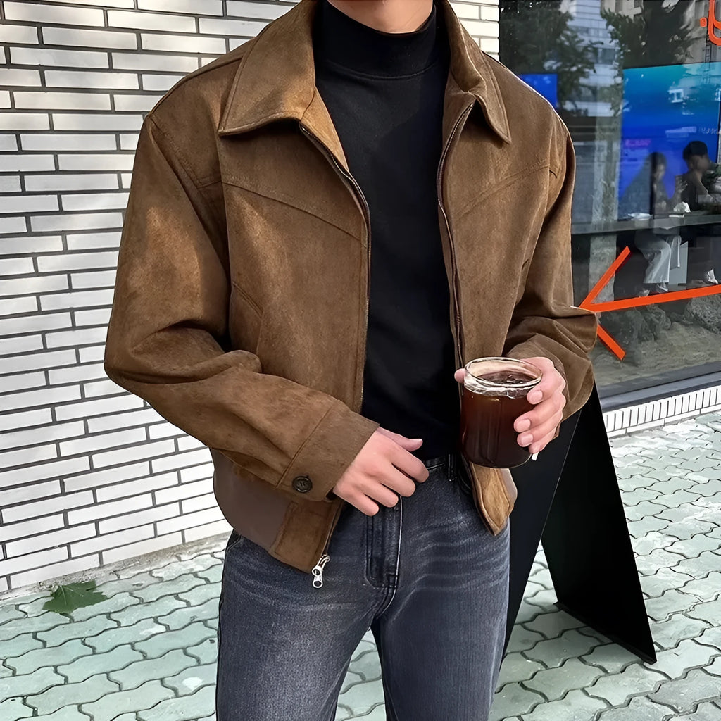 Short jacket with loose lapels in brown suede-style fabric, front view, on a plain background.