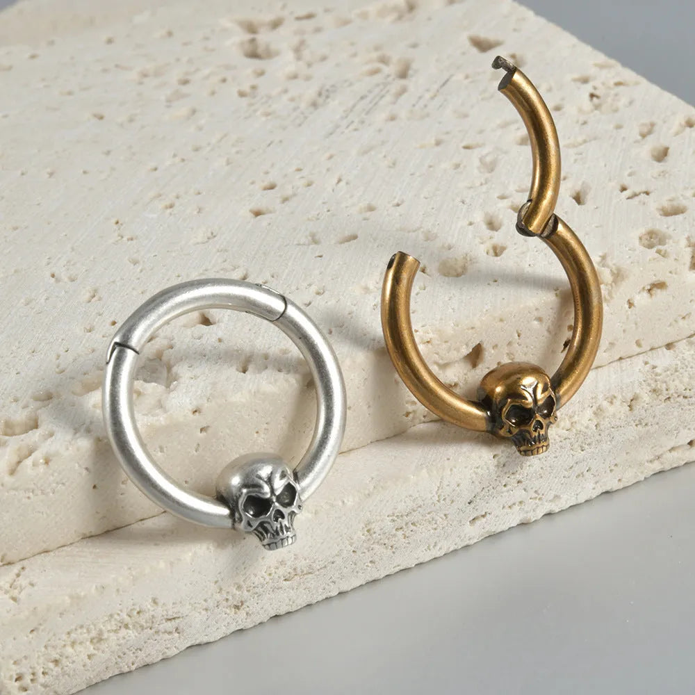 Copper punk earrings with vintage ghost head designs in antique gold and silver metallic finishes