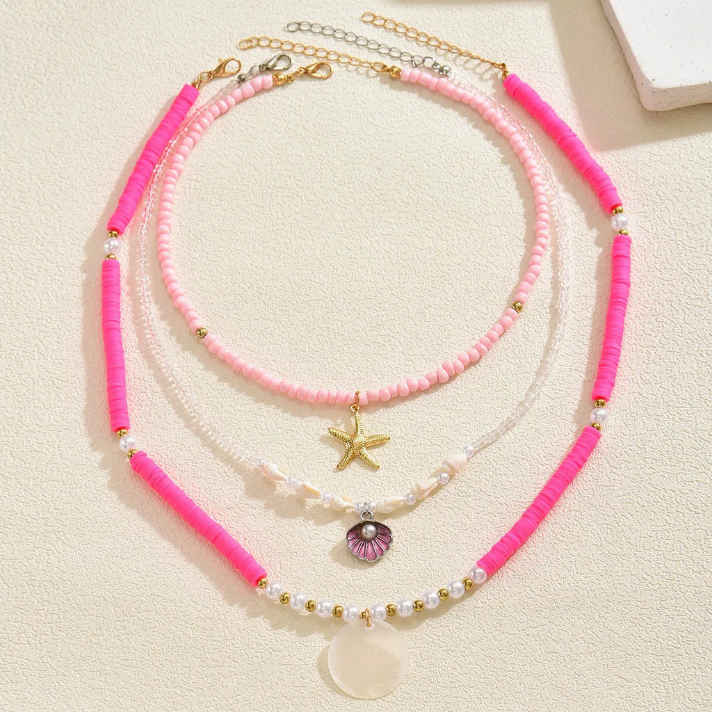 Polymer clay beaded necklace with multi-layer twin clavicle chain and geometric alloy pendant on female model