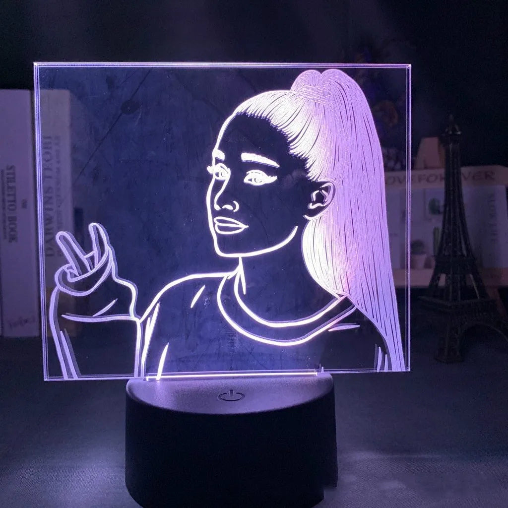 Slim black-based acrylic 3D LED night light showing colour display on wall