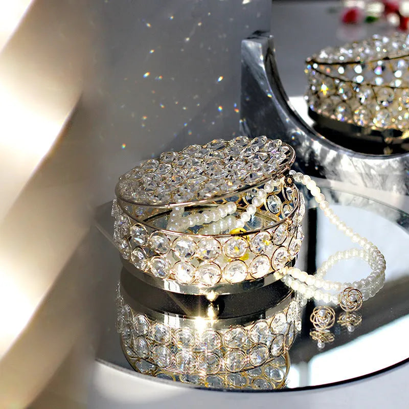 Transparent crystal glass jewellery storage box with French gold metal finish in a European style.