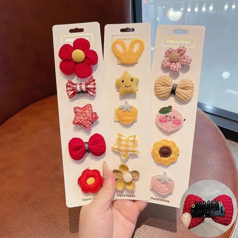 Red and pink plaid plastic cartoon mini dog hairpin sets on a light background