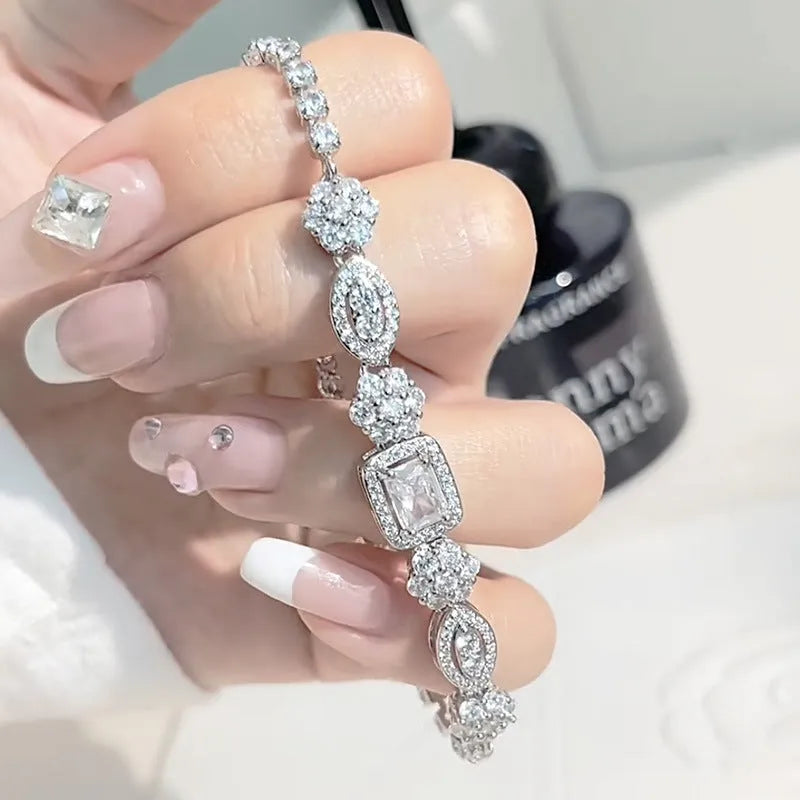 Women's sterling silver-plated bracelet with white gold finish and inlaid zircon stones.