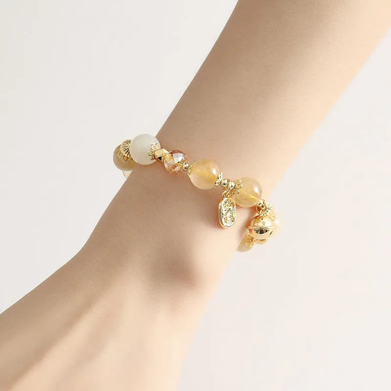 Gold tone rutilated quartz bracelet with electroplated finish and Korean style design
