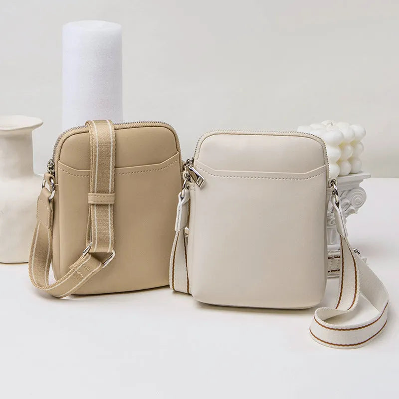 Solid colour PU leather mobile phone crossbody shoulder bag shown in beige.