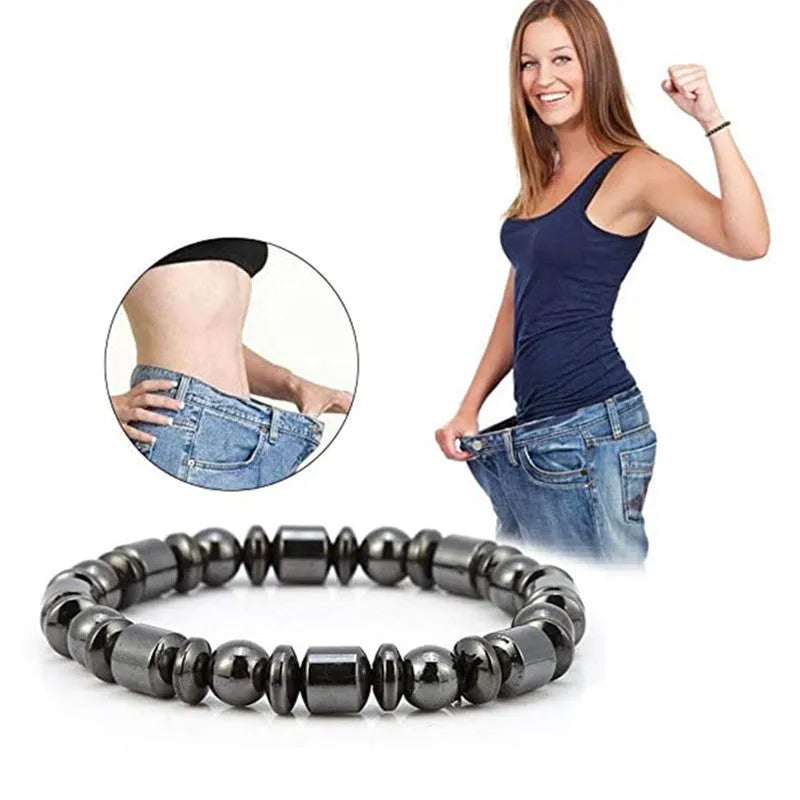 Black pentagram pattern magnetic therapy bracelet with magnetite and hematite stones on a stretch band.