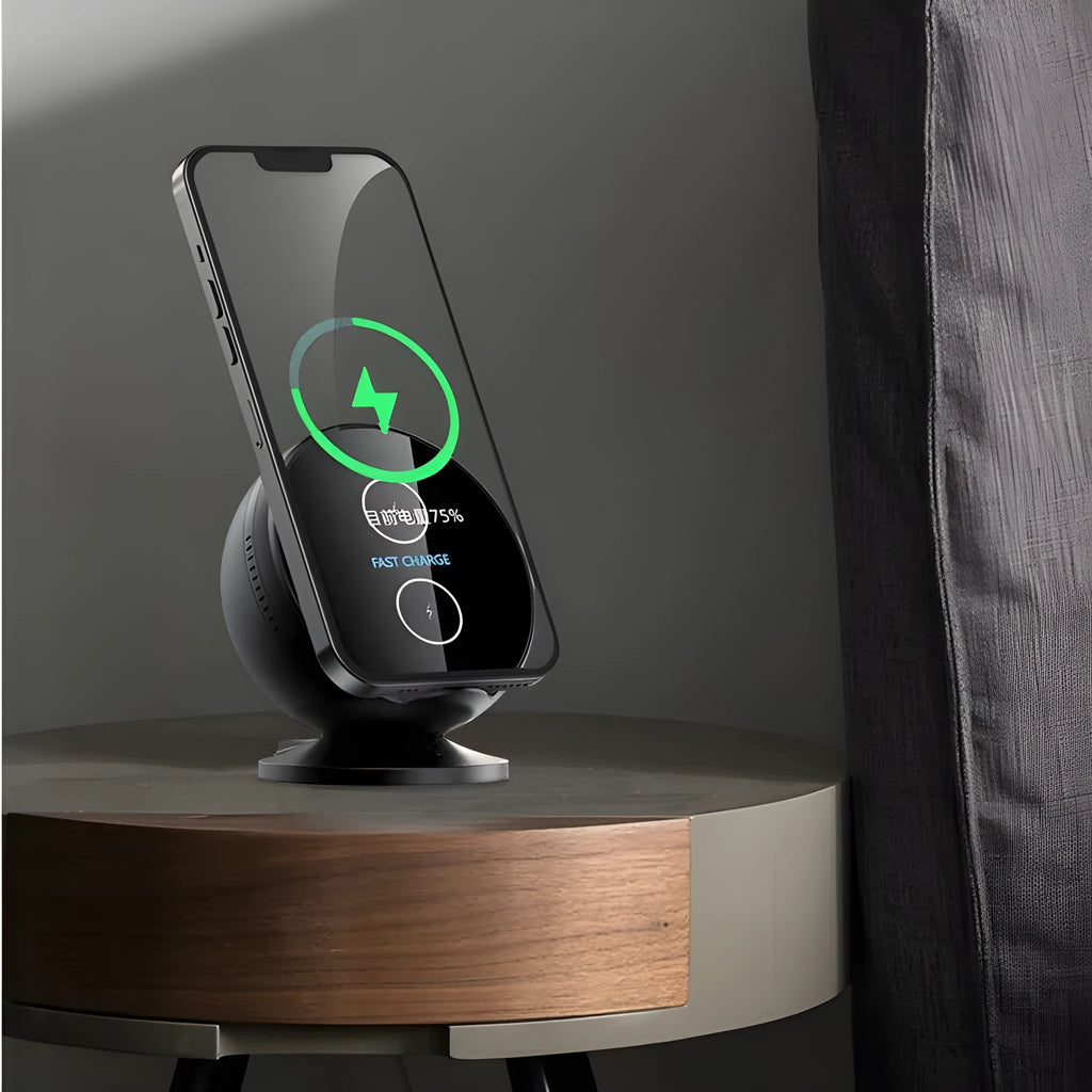 Black multifunctional mobile phone wireless charger holder with Bluetooth speaker, showing phone in cradle.