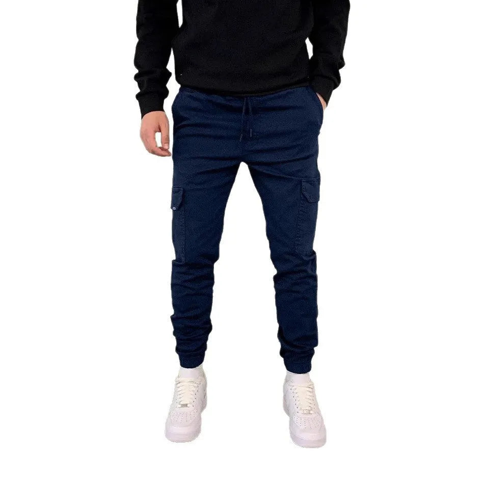 Men's light blue polyester baggy trousers with dimensional patch pockets and straight leg casual styling