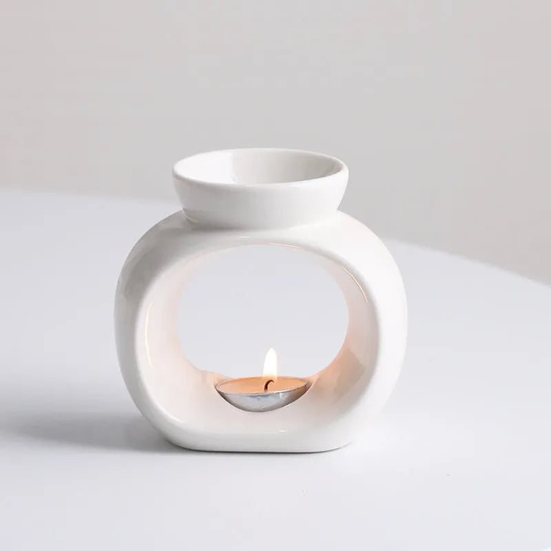 White ceramic Nordic style aromatherapy stove ornament with anti-dry burning design.
