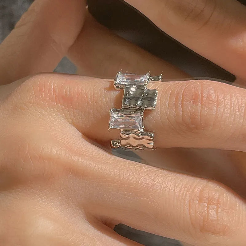 Silver-plated geometric open ring with cross zircon centrepiece and three-dimensional decoration