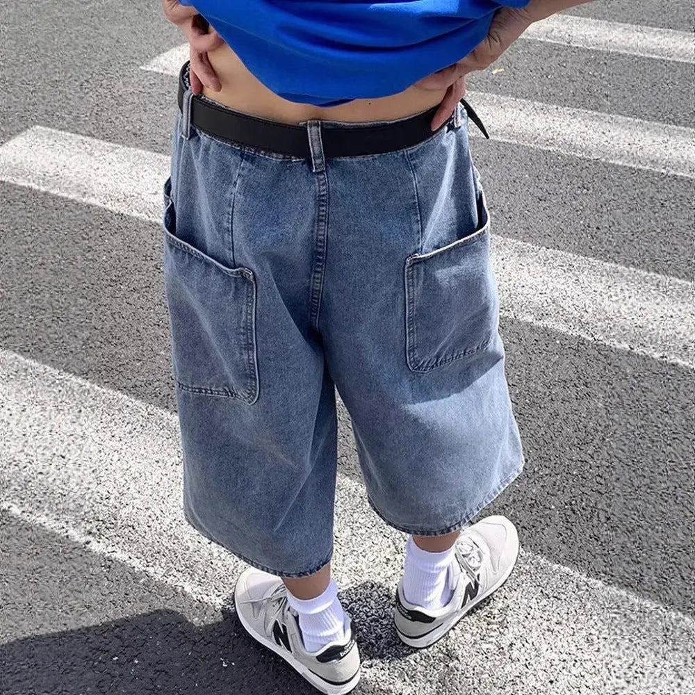 Men's washed light blue denim pirate shorts with a high waist and straight cropped legs on a plain background.