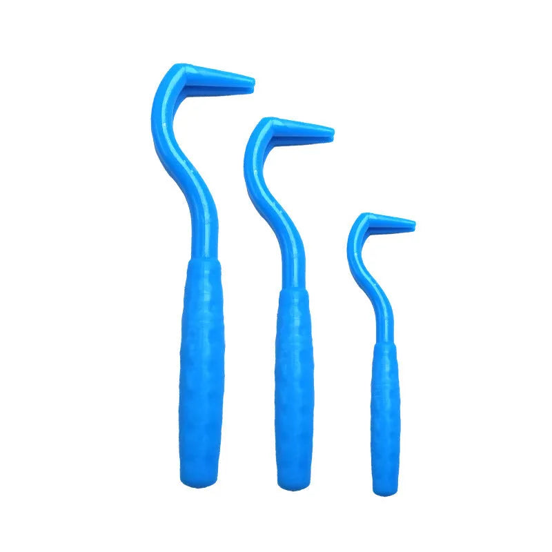 Set of three coloured plastic tick hook removal tools for dogs on a white background.
