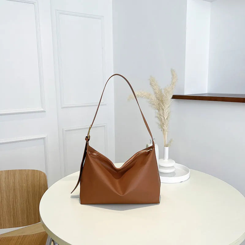 Large capacity simple PU tote bag in black, brown, or coffee colour with single shoulder strap and no lining