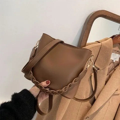 Woven PU one-shoulder crossbody bucket bag in retro style, shown in khaki colour.