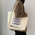 Natural colour canvas tote bag with metal magnet buckle closure and small front pocket, 32x31.5x10cm