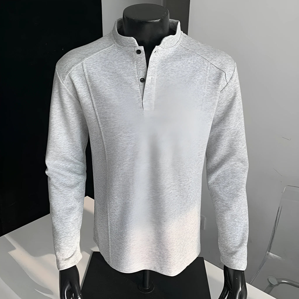Men's grey asymmetrical stand-up collar cotton polo shirt with patchwork shoulder detail.
