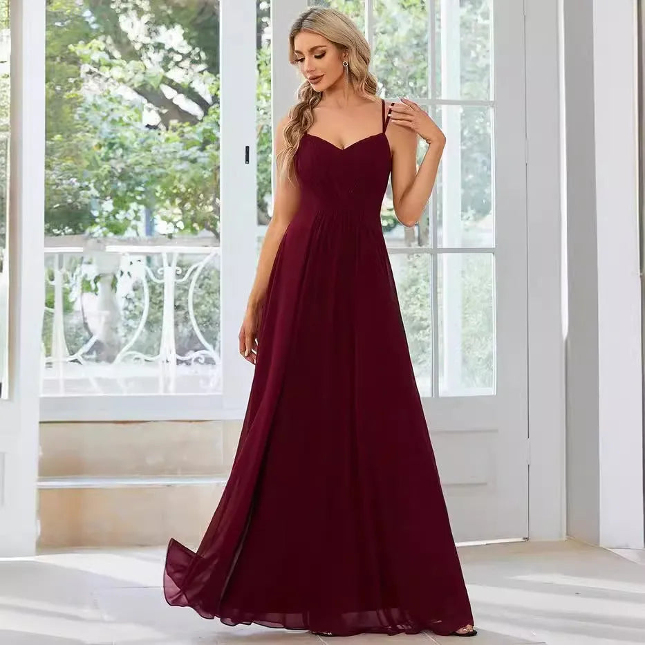 Women's long sleeveless A-line dress with pleated skirt in solid colour options