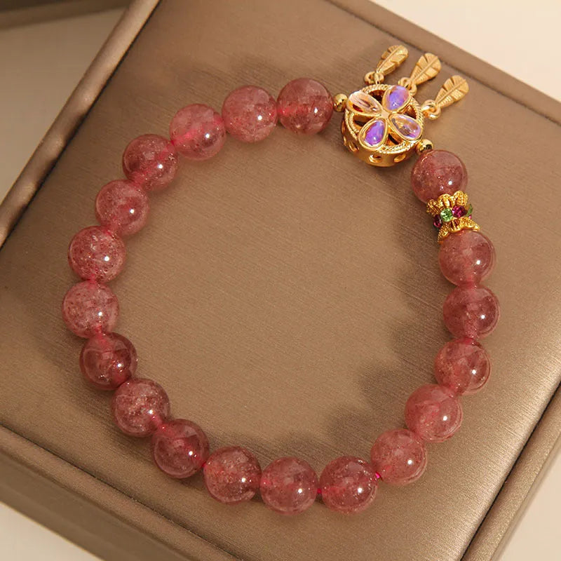 Women's bracelet with strawberry quartz dream catcher pendant on wrist