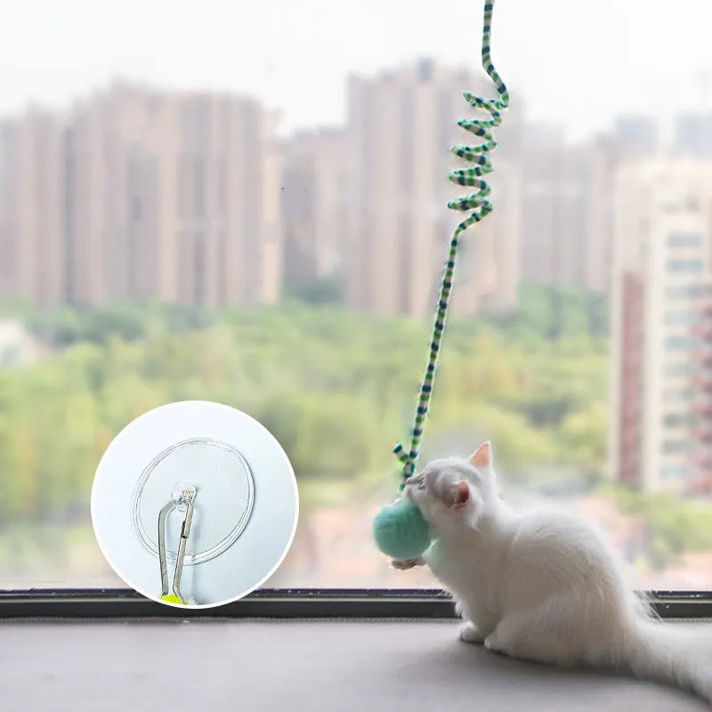 Hanging cat toy with long spring, inflatable ball, bell, and suction cup in various colours