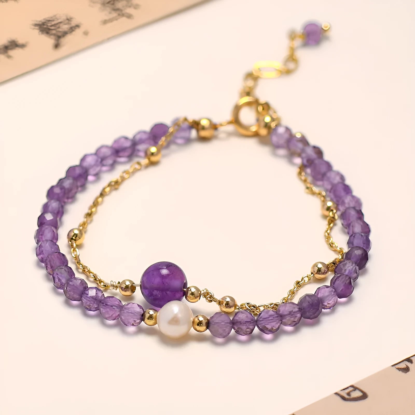Chinese style amethyst coloured crystal bracelet for women with electroplated diamond shapes.