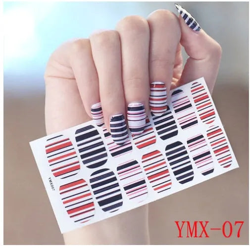 Full nail stickers set of 14 sheets showing 16 colour options in a flat lay arrangement