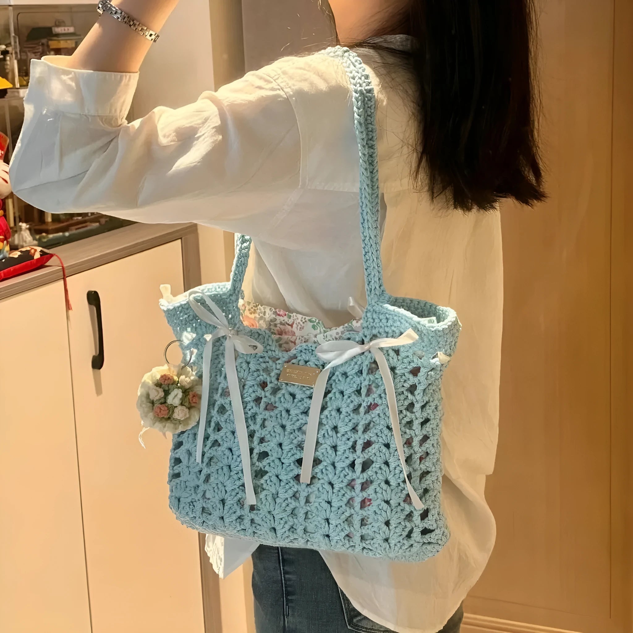 Handwoven wool floral handbag in summer style with natural pattern