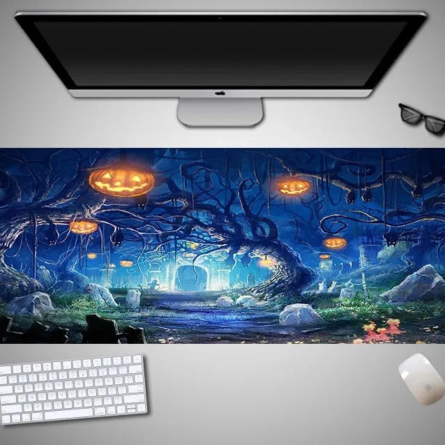 Oversized Halloween graphic cloth mouse pad on a desk, showing non-slip rubber base.