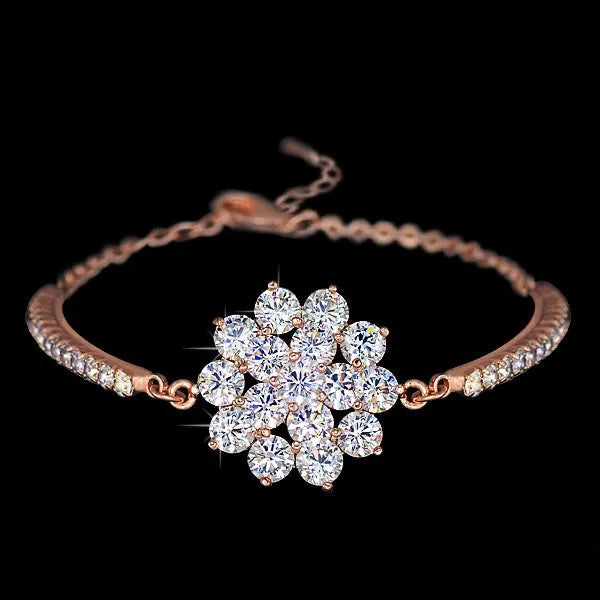Rose gold cubic zirconia bracelet with cross crown Roman numeral motifs on alloy setting