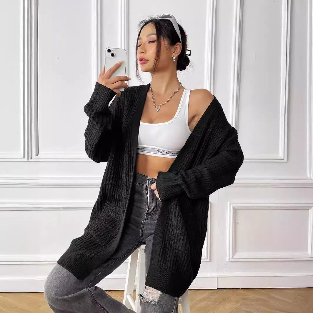Women's loose fit acrylic cardigan with double pockets in dark green colour