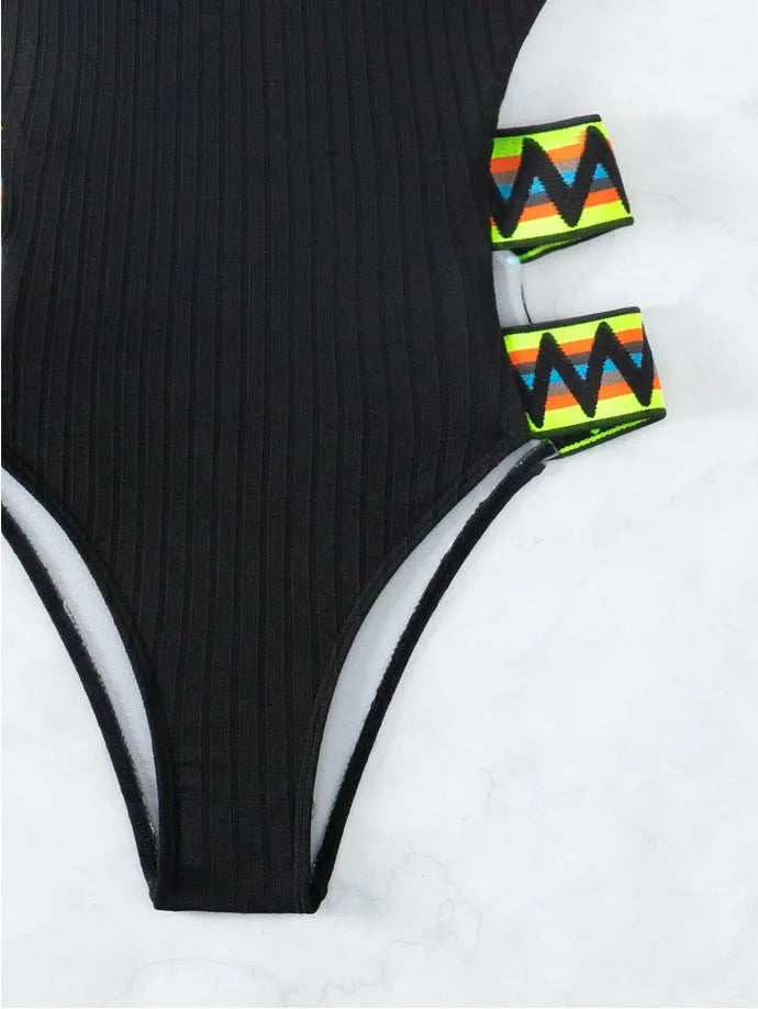 Women's solid black one-piece swimsuit bikini made from polyester fabric