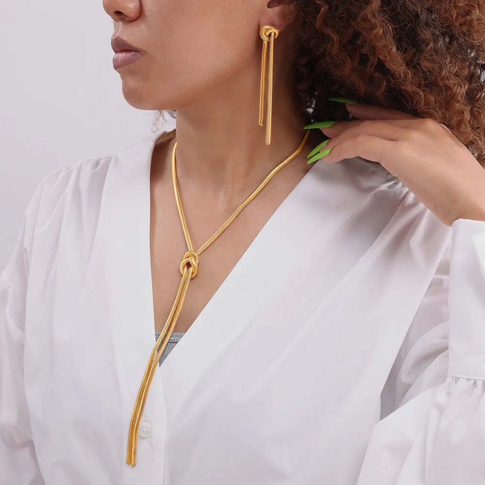 Gold knotted tassel necklace and matching earrings set with snake chain