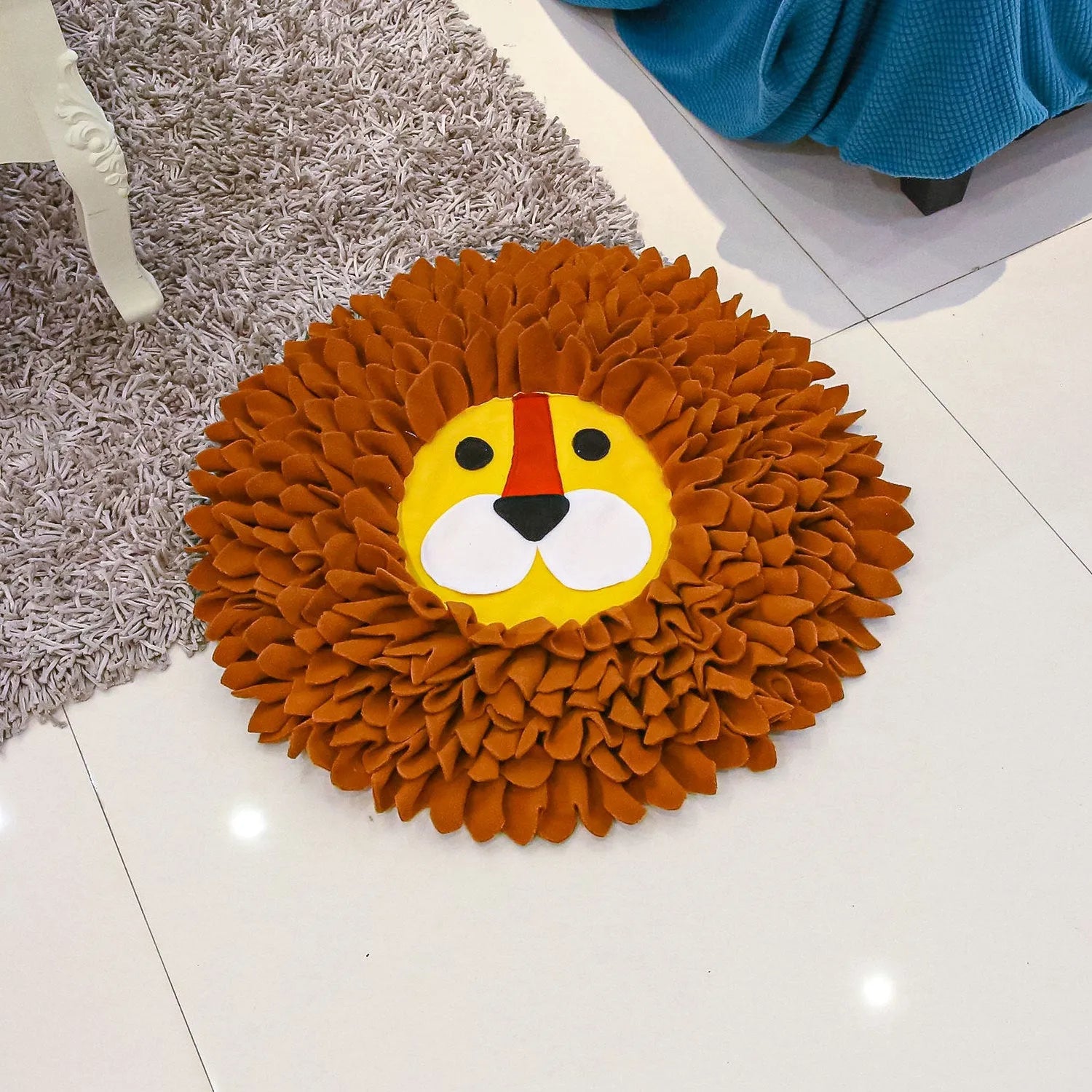 Brown lion-shaped pet sniffing pad with textured fabric for hiding dog or cat food.