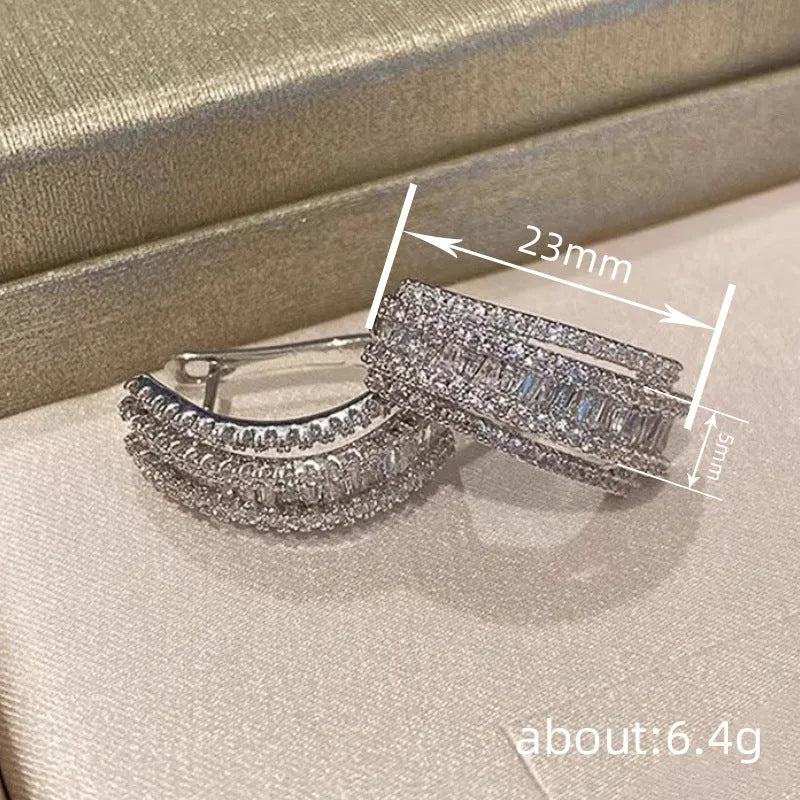 Geometric zircon stud earrings in white gold colour with copper construction