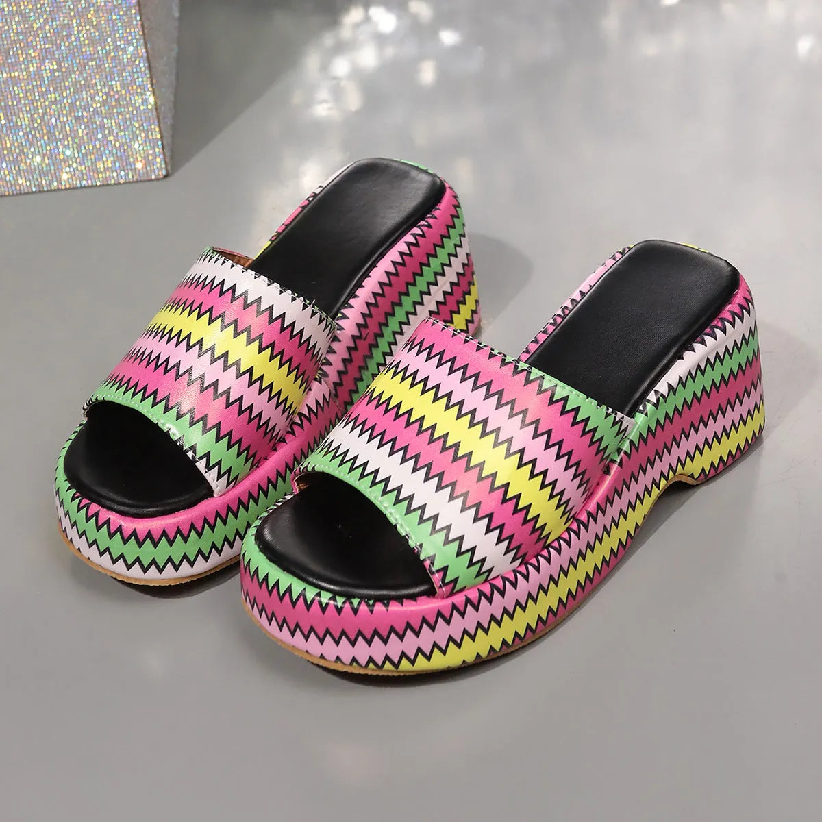 Women's beige wedge sandals with a blue and pink wave print design, thick rubber sole, and fish mouth toe.