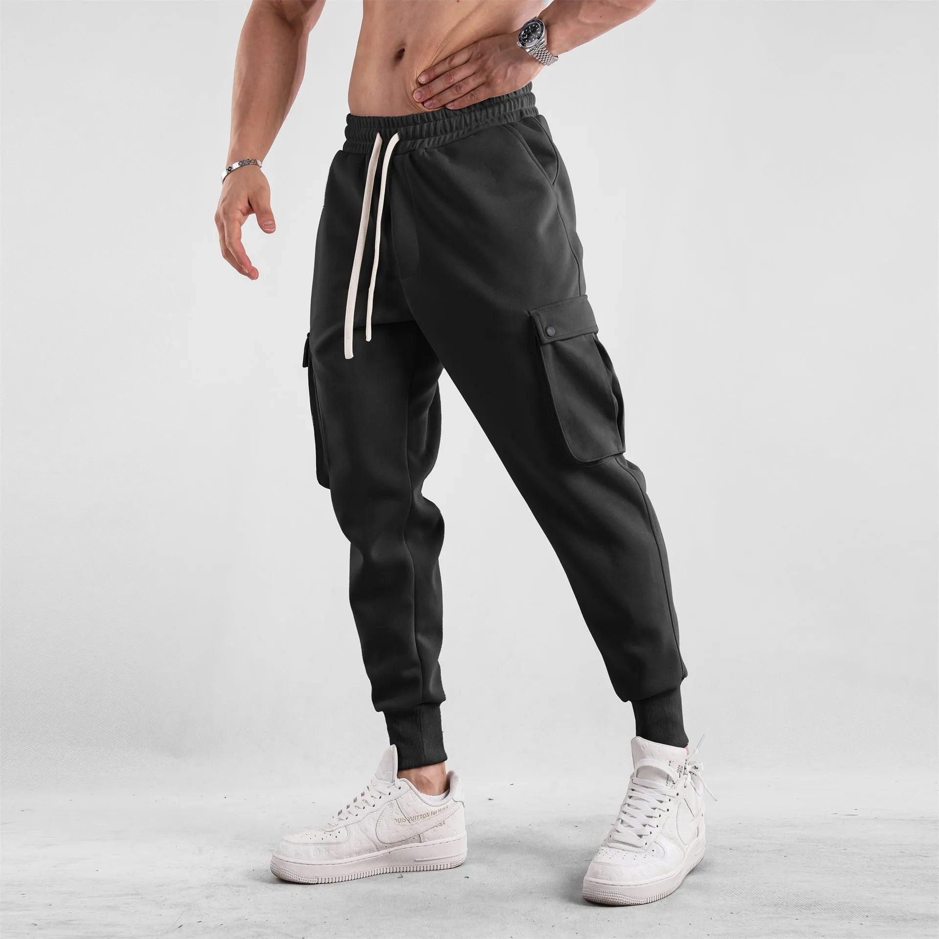 Men's cotton sports trousers with ankle ties and multiple pockets in apricot colour