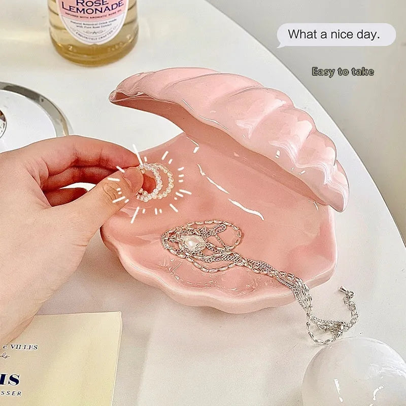 White porcelain decorative tray with optional small night light, shown in pink and yellow colour options.