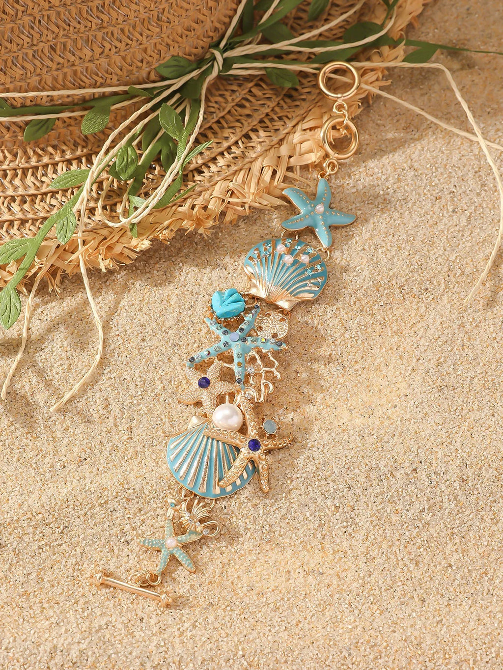 Alloy rhinestone marine bracelet with boat anchor and shell details in blue coral colour