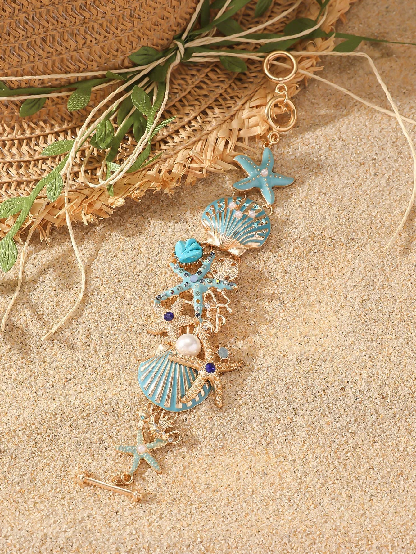 Alloy rhinestone marine bracelet with boat anchor and shell details in blue coral colour