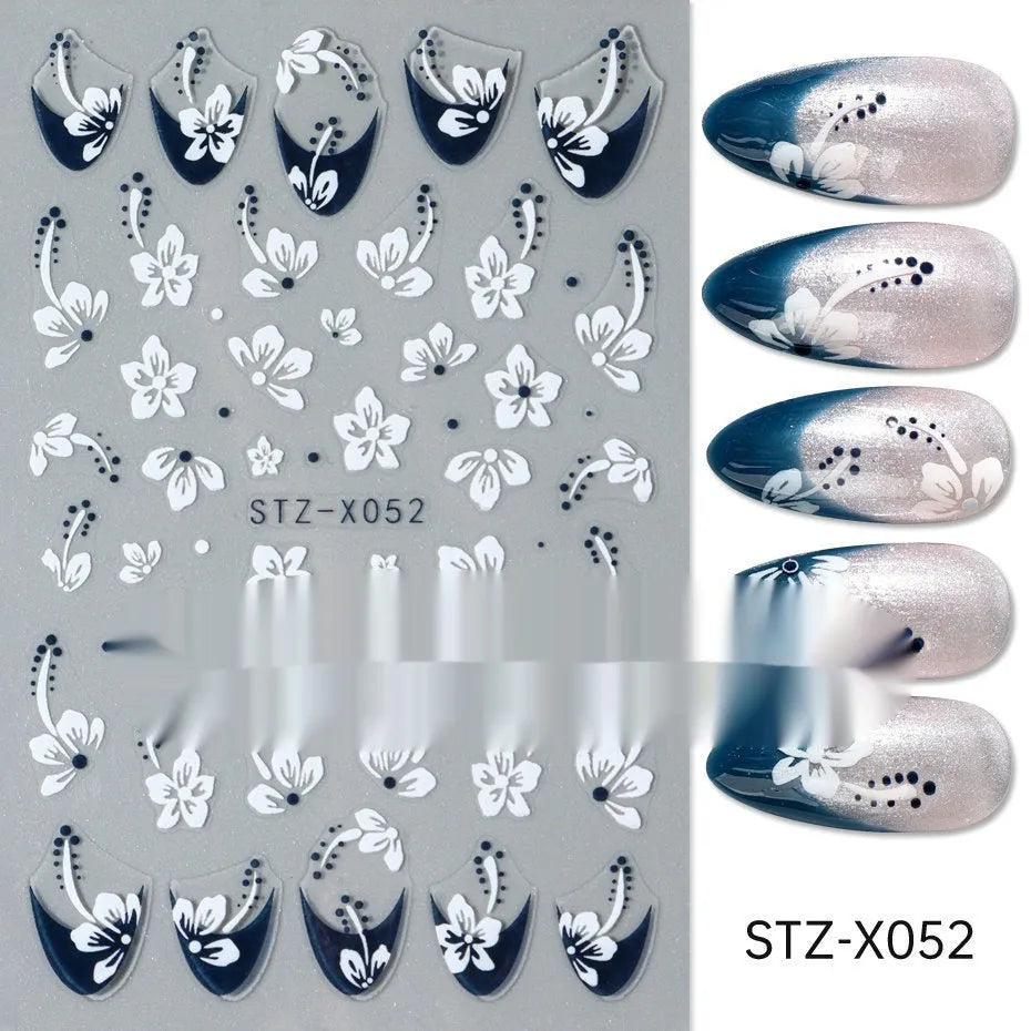 Pack of black and silver striped nail art stickers with cartoon and love pattern designs.