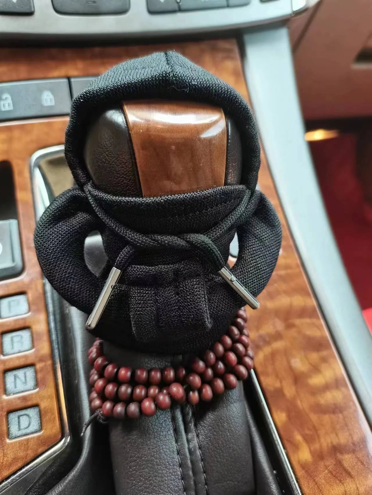 Dutch velvet car gear handle sleeve cover shown in various colours including black, red, blue, and pink.