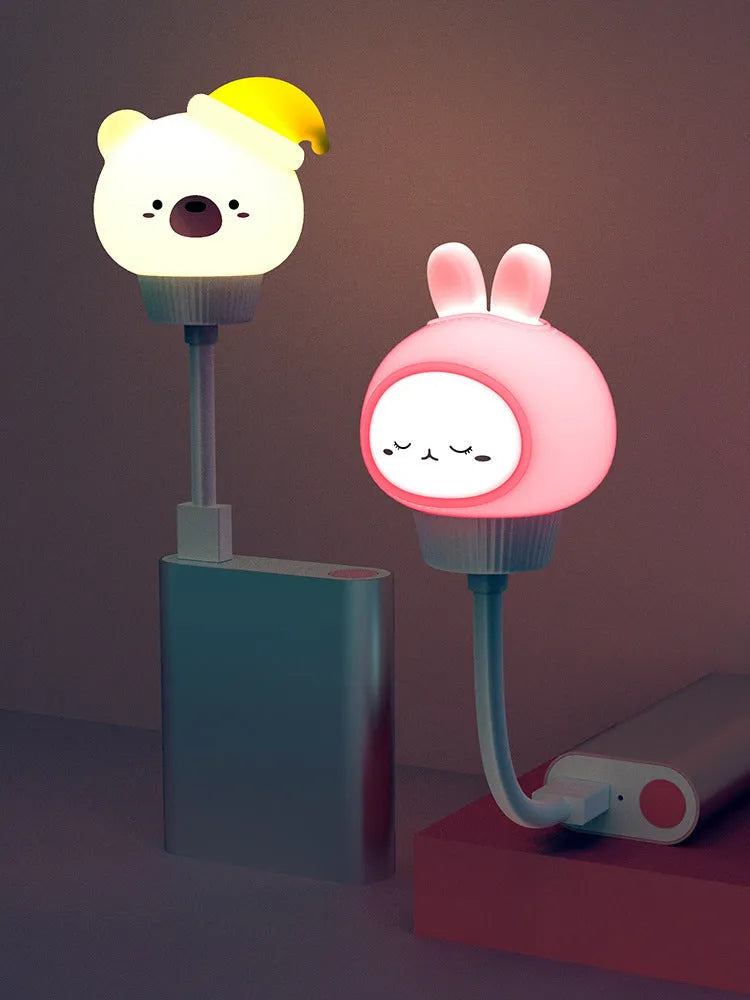 Cartoon animal USB night light with adjustable brightness on bedside table