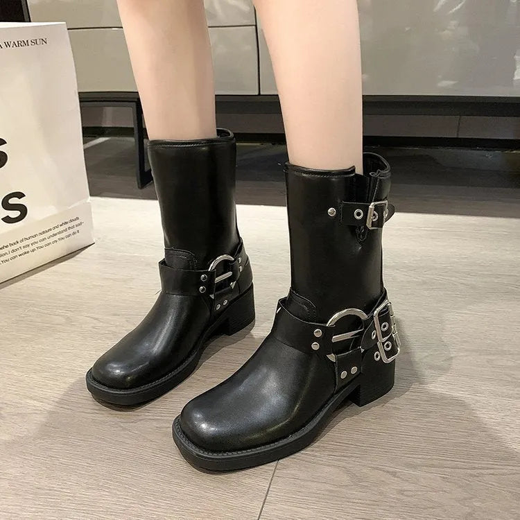 Women's black platform boots with belt buckle detail and lace-up closure, mid-calf length
