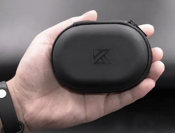 Black leather oval-shaped earphone storage pouch for portable headphones.