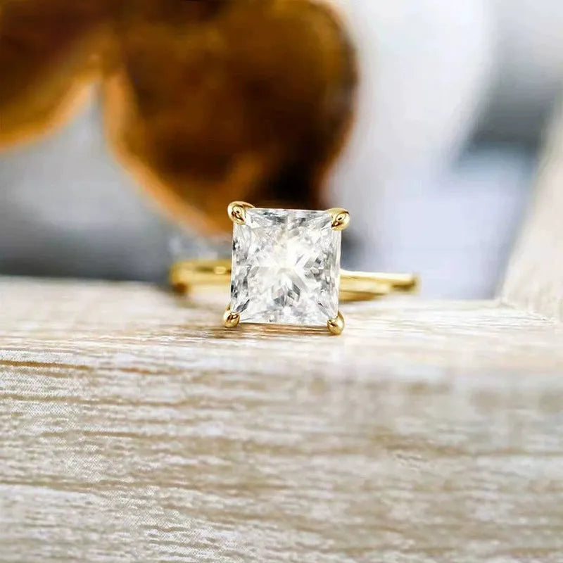 A simple geometric 925 sterling silver ring for women, shown in silver, gold, and rose gold colour options on a grey background.