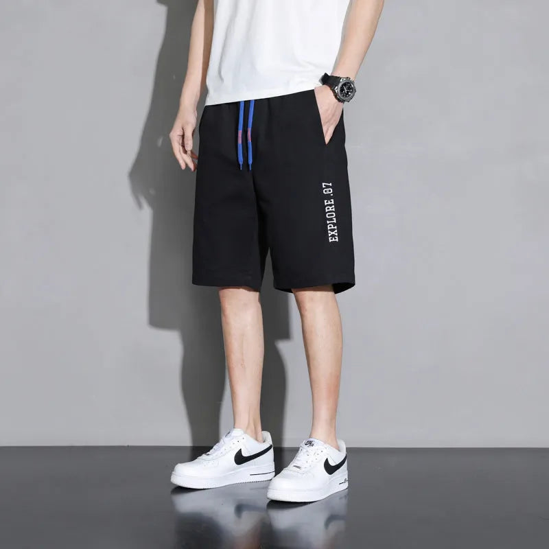 Boys' cotton shorts in black, shown in a casual style for summer home and sports wear.