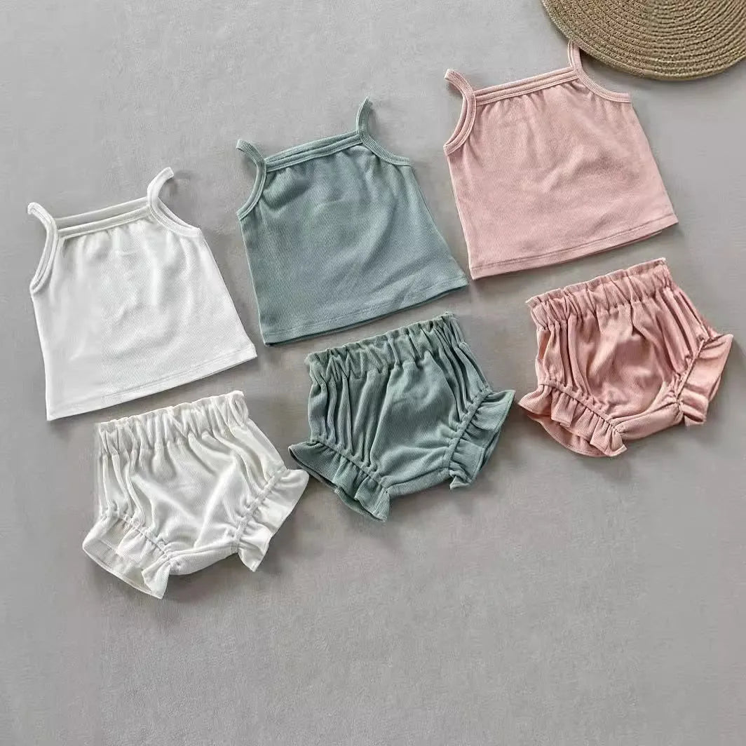 Women's cotton rib home wear two-piece set with sleeveless top and shorts in rose colour on white background