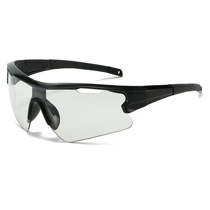 Windproof sports cycling sunglasses in black frame with grey lens on outdoor background.