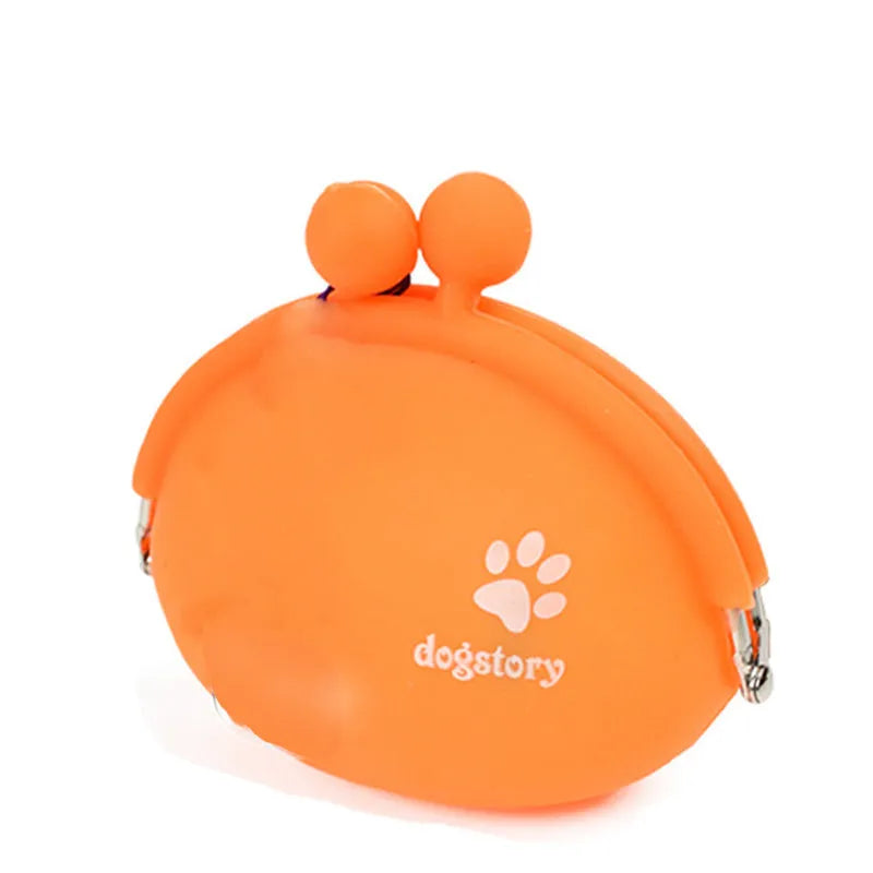 Yellow silicone dog treat pouch with hook and loop strap, shown on a waistband.