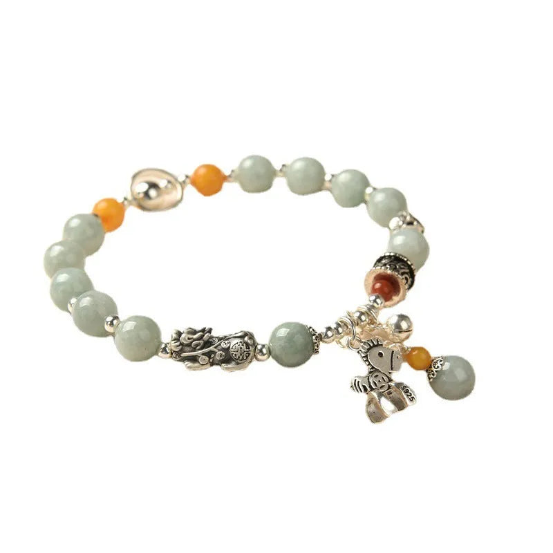 Natural emerald green vintage bracelet with jade stones on an alloy band, showing retro hand-crafted design.