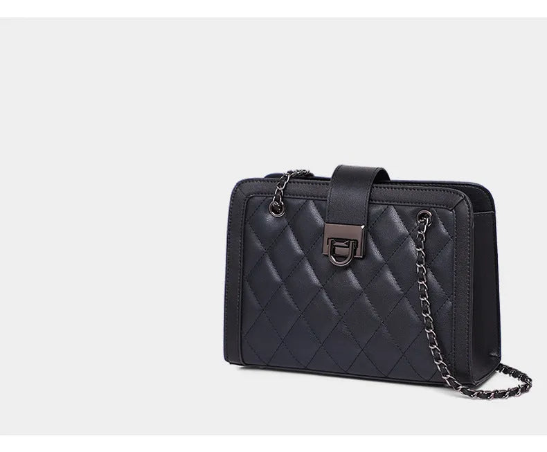 Women's black genuine leather chain crossbody square bag, soft underarm handbag on model
